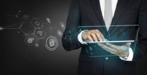 Businessman in Suit Using Digital Tablet